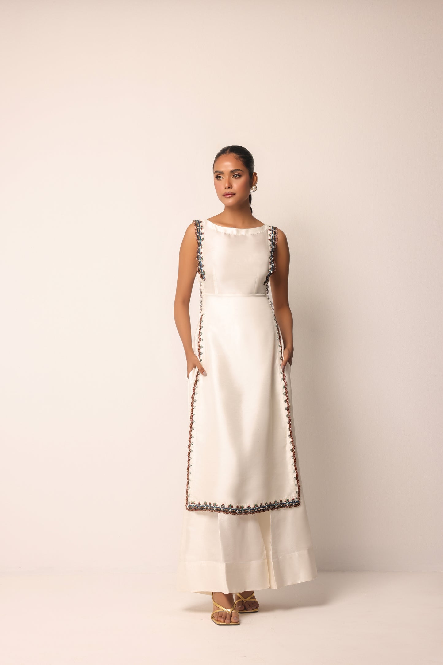 Beaded and scalloped trim detailing on the edges of the designer co-ord set