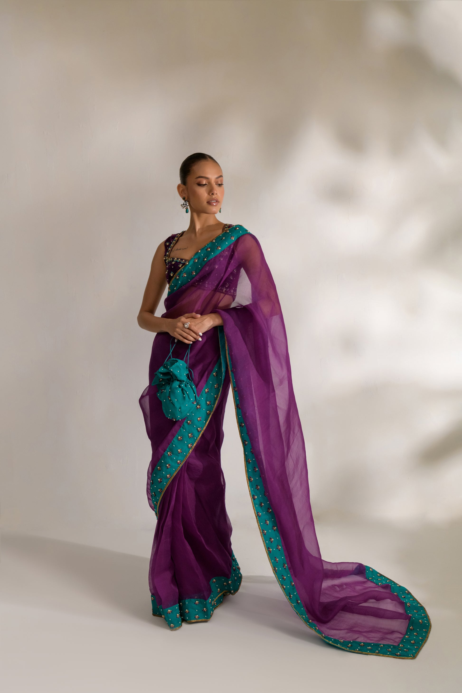 Deep purple sleeveless blouse with beadwork and intricate embroidery