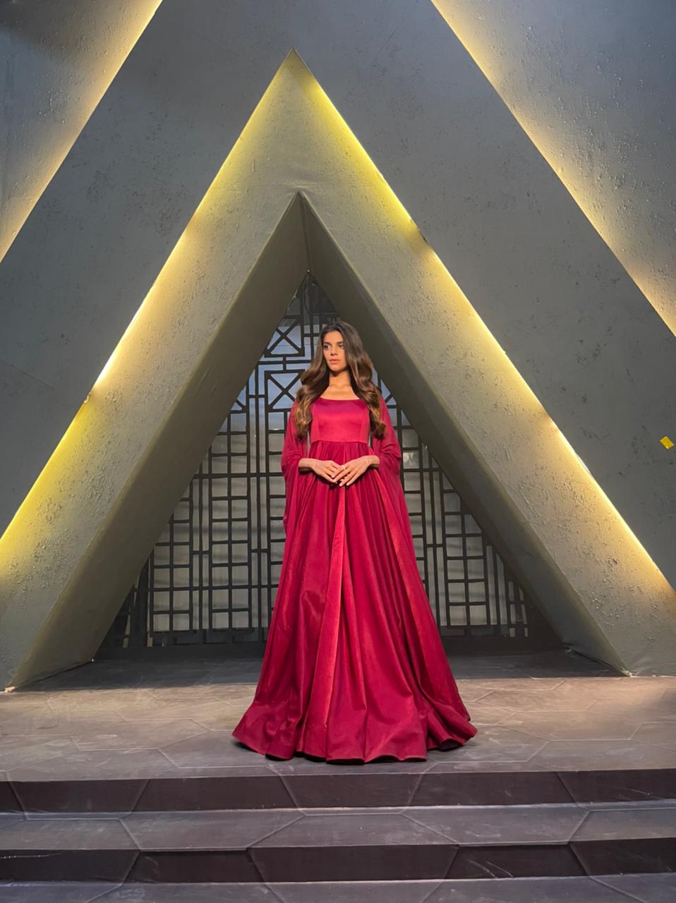 Deep red flared designer gown for weddings and special events