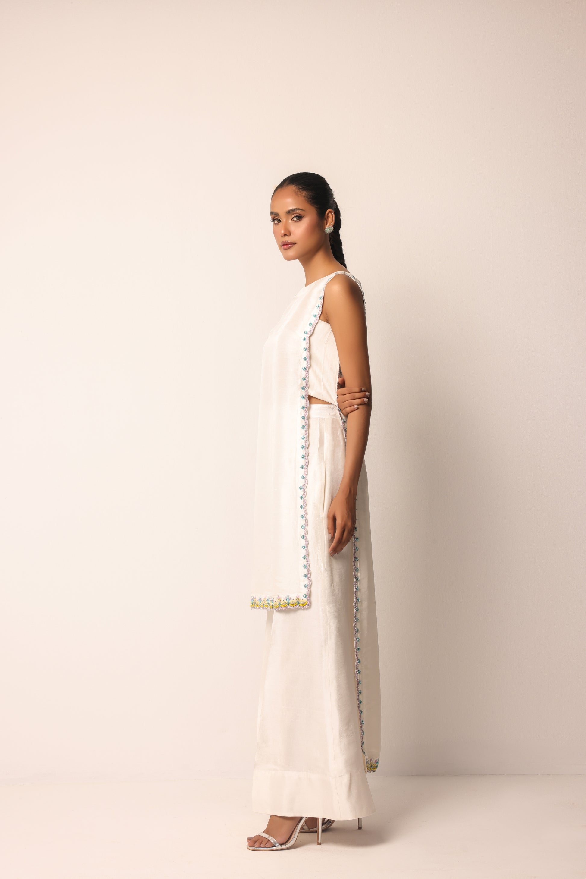 Delicate embroidery trim along the edges of the designer dress