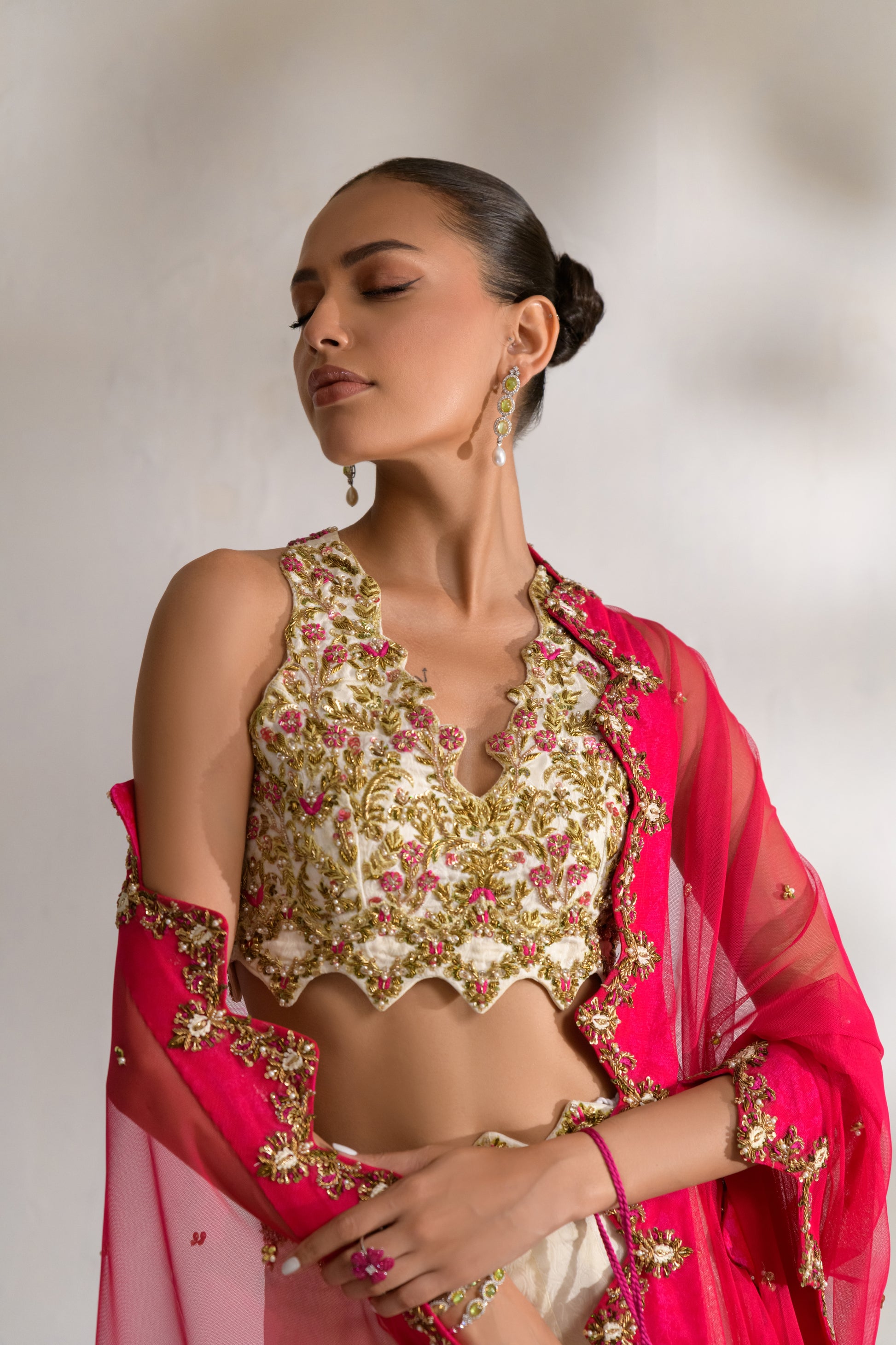 Designer dress with intricate thread work and metallic detailing