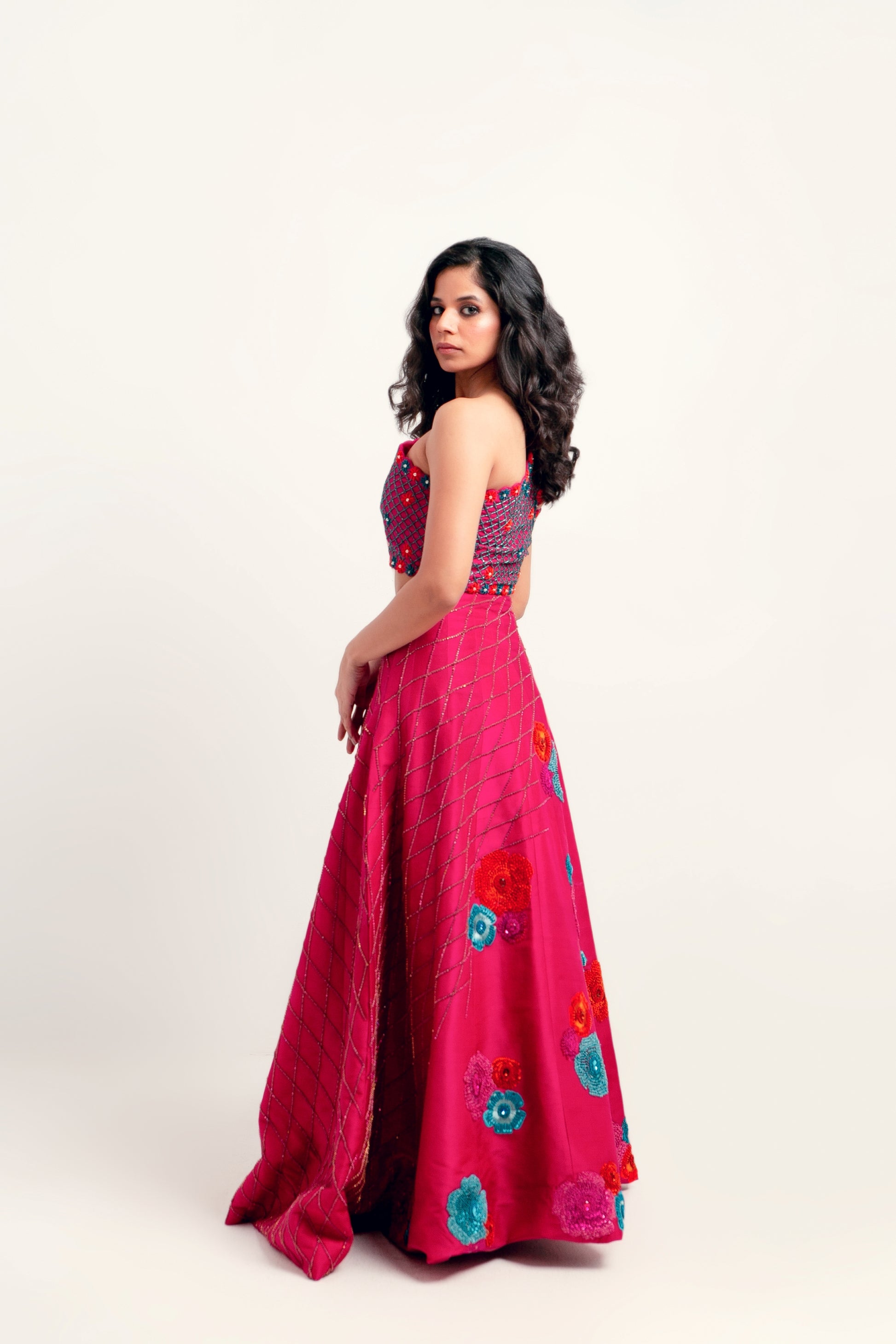 Embellished silk lehnga choli with diagonal embroidery and floral motif