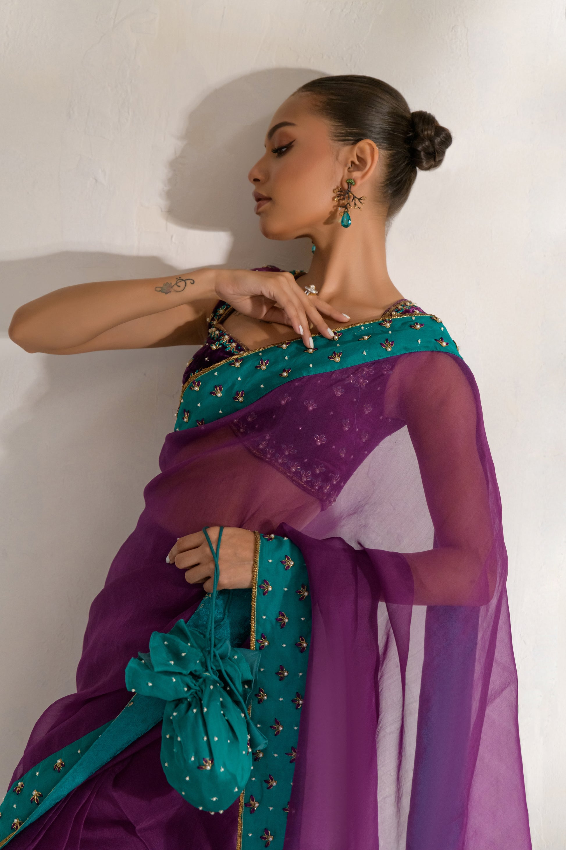 Floral embellished border detail on luxury purple saree