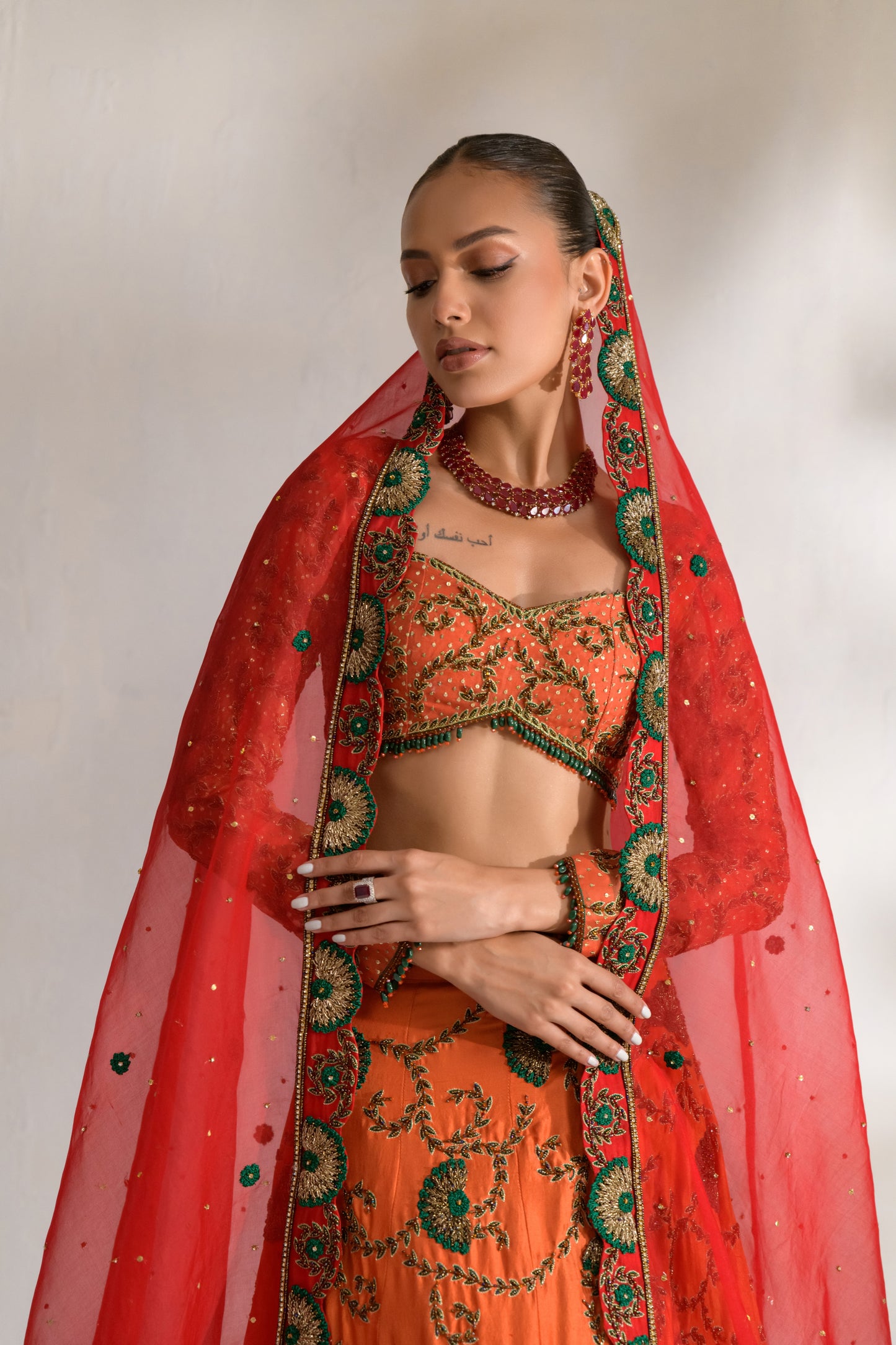 Full sleeve embellished choli with deep neckline and green threadwork