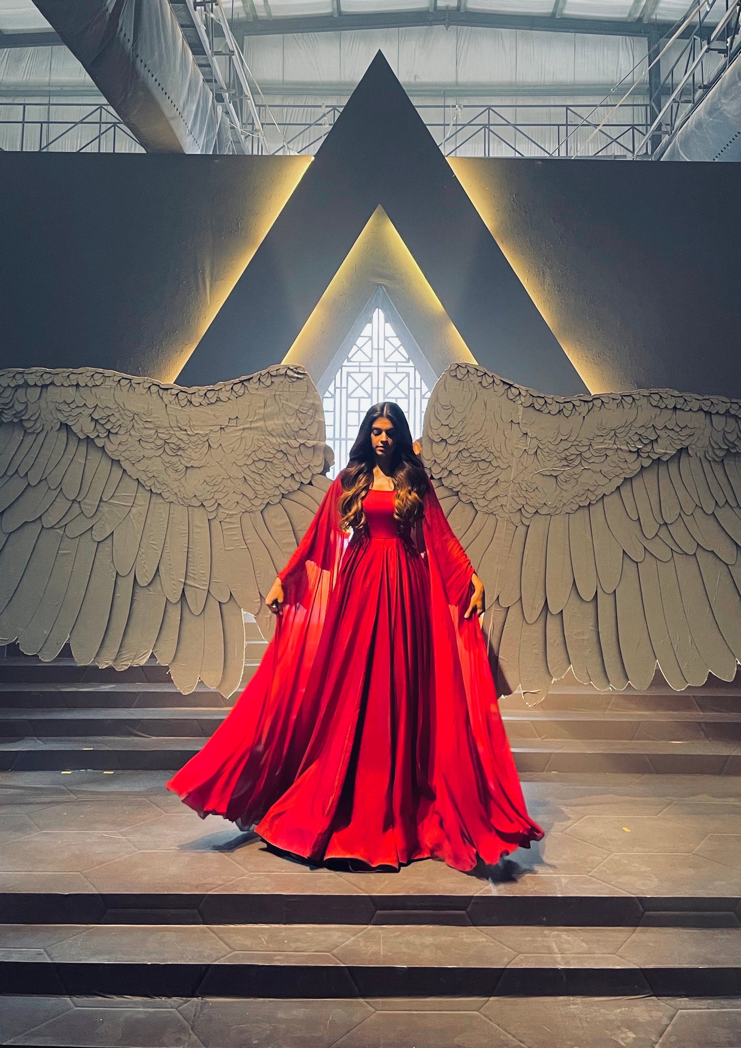 Haute couture red gown with graceful cuts and premium silk material