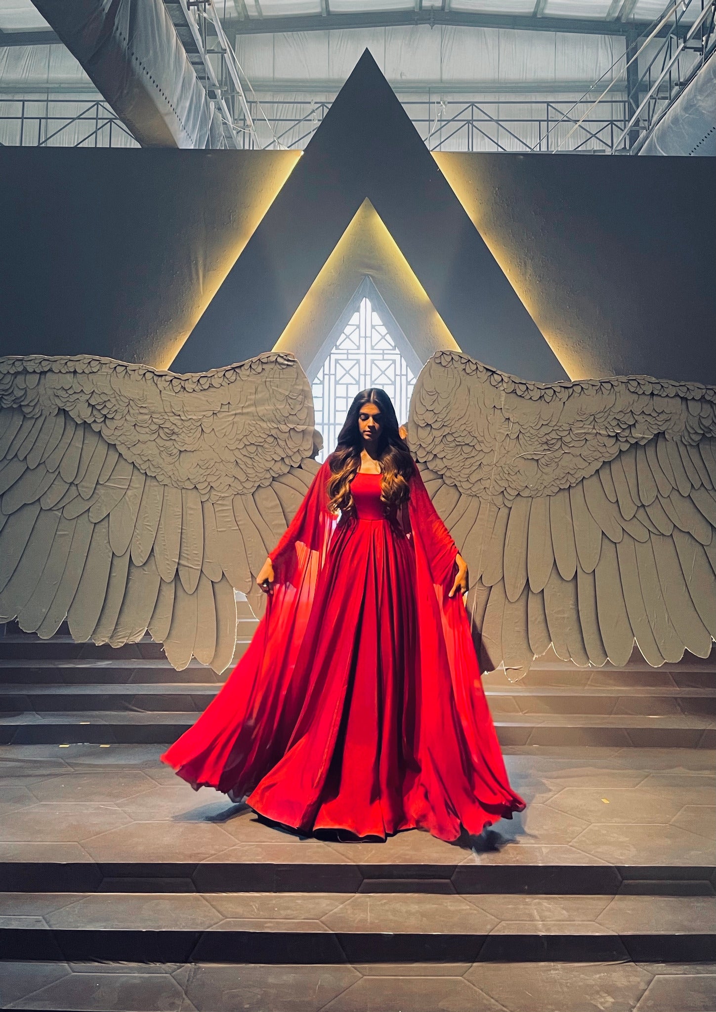 Haute couture red gown with graceful cuts and premium silk material