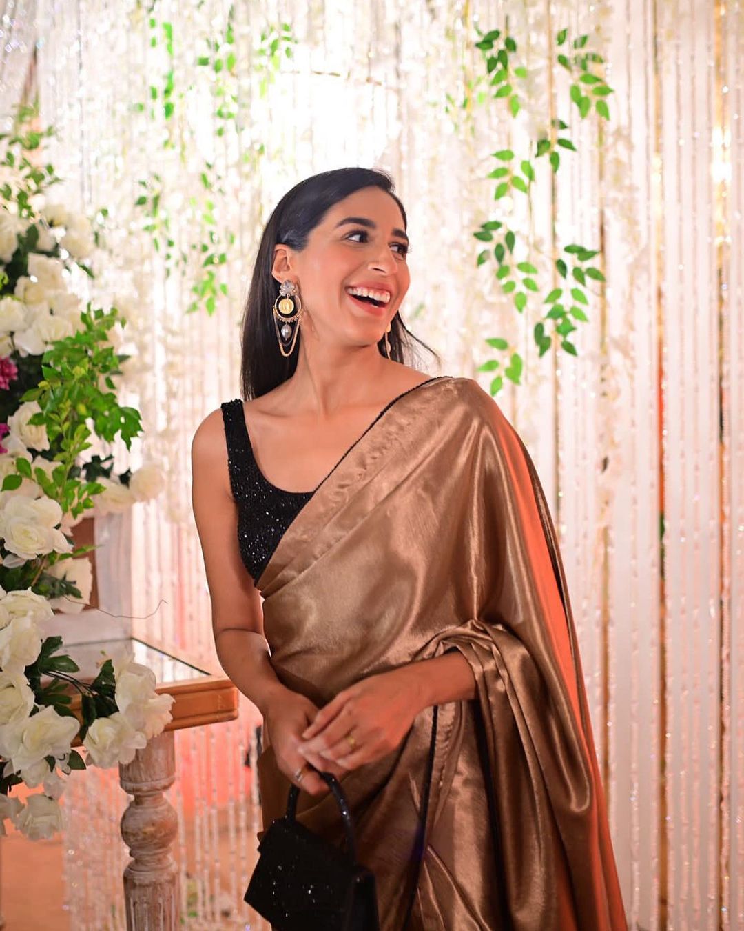 Elegant satin finish Aemal saree for evening wear
