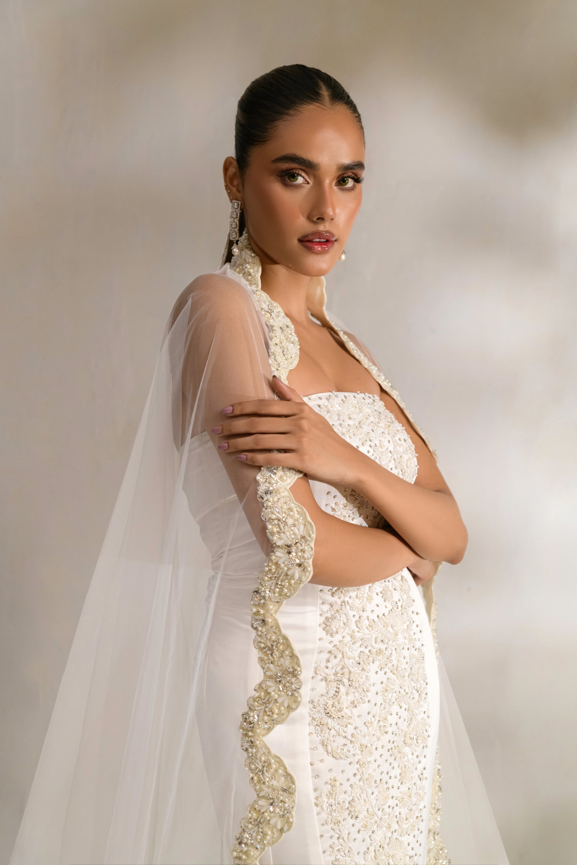 Grace bridal gown paired with a statement veil for a timeless look