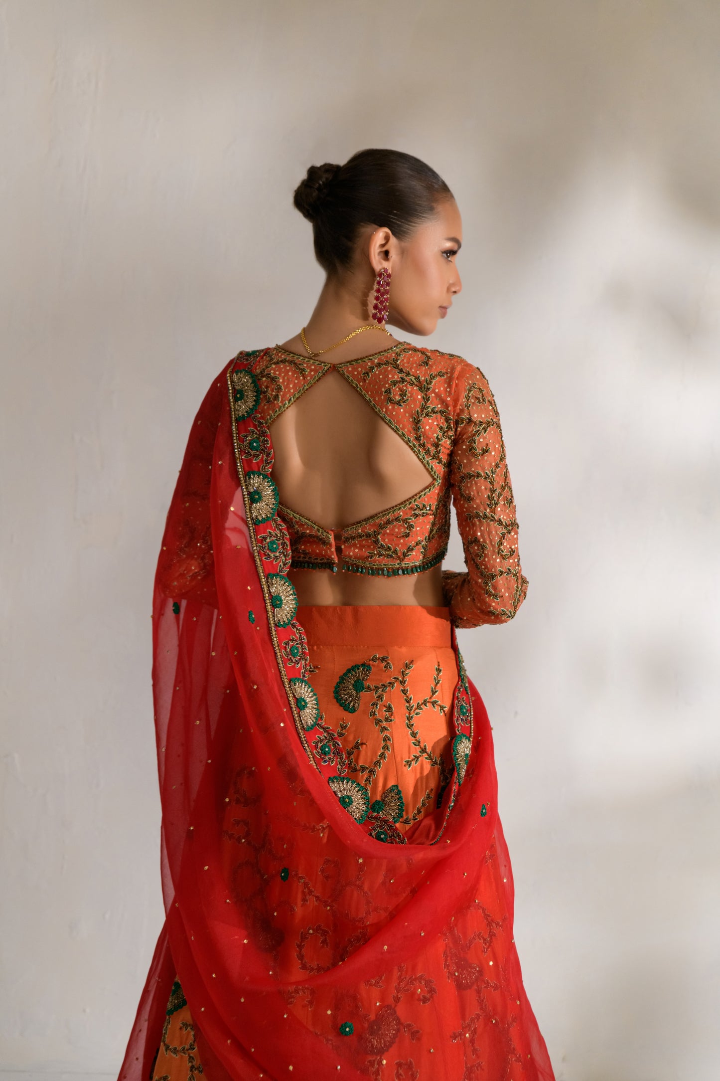 Flared lehnga with tie-dye accents and intricate hand embroidery