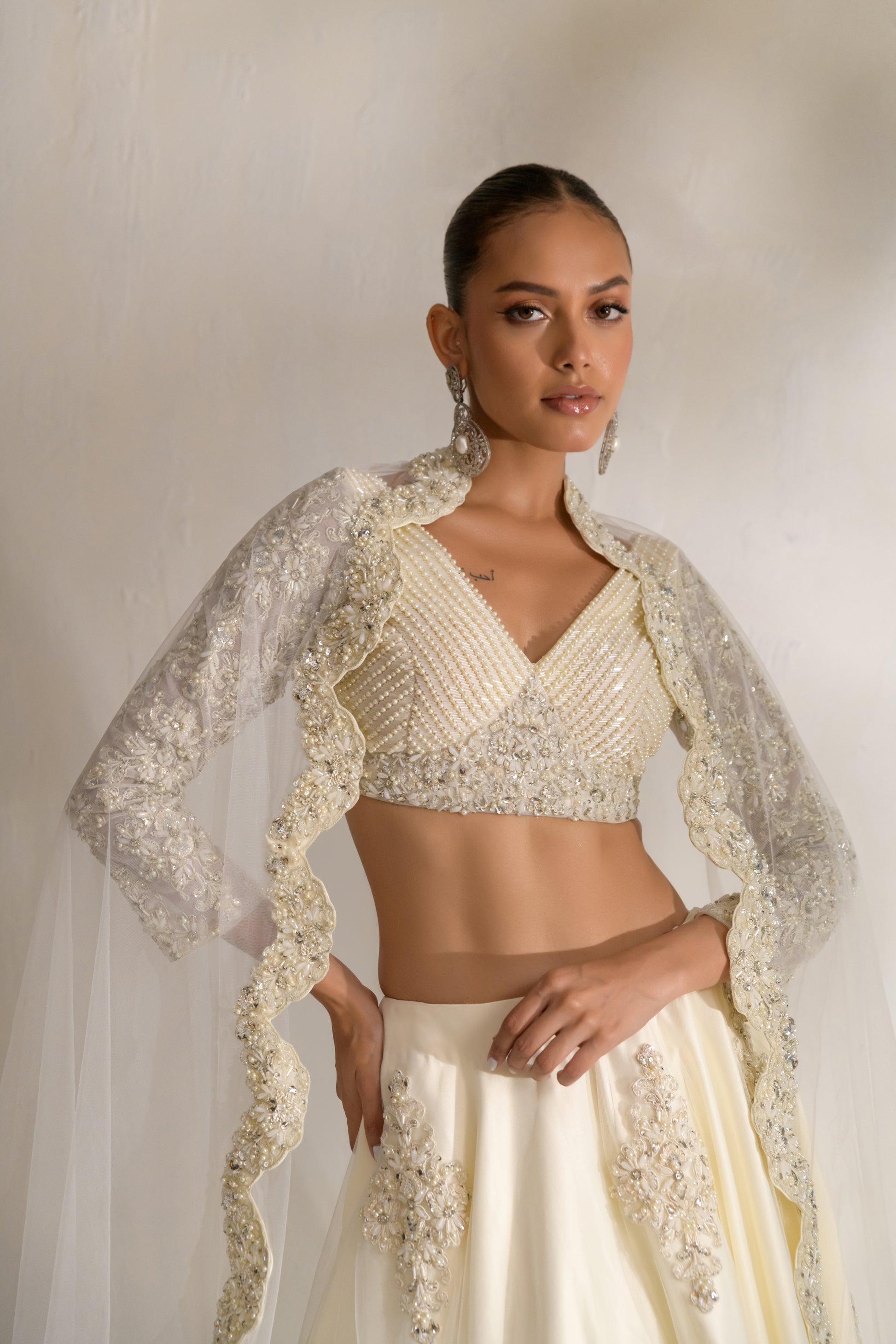 V-neck blouse with pearl pleats and full embellished sleeves