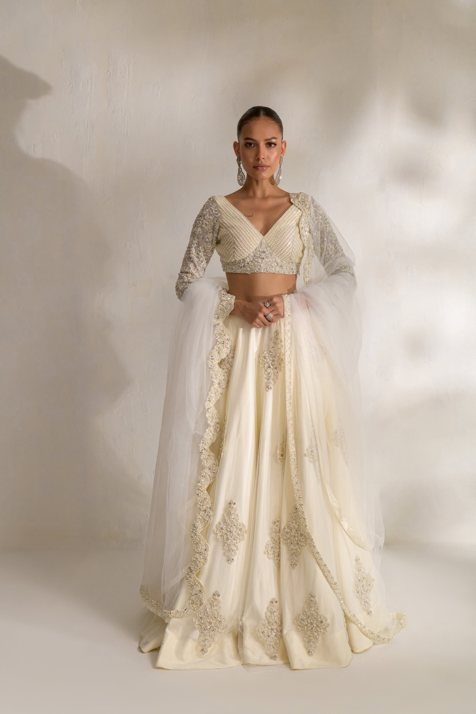 White designer lehnga choli with marori threadwork and silver sequins