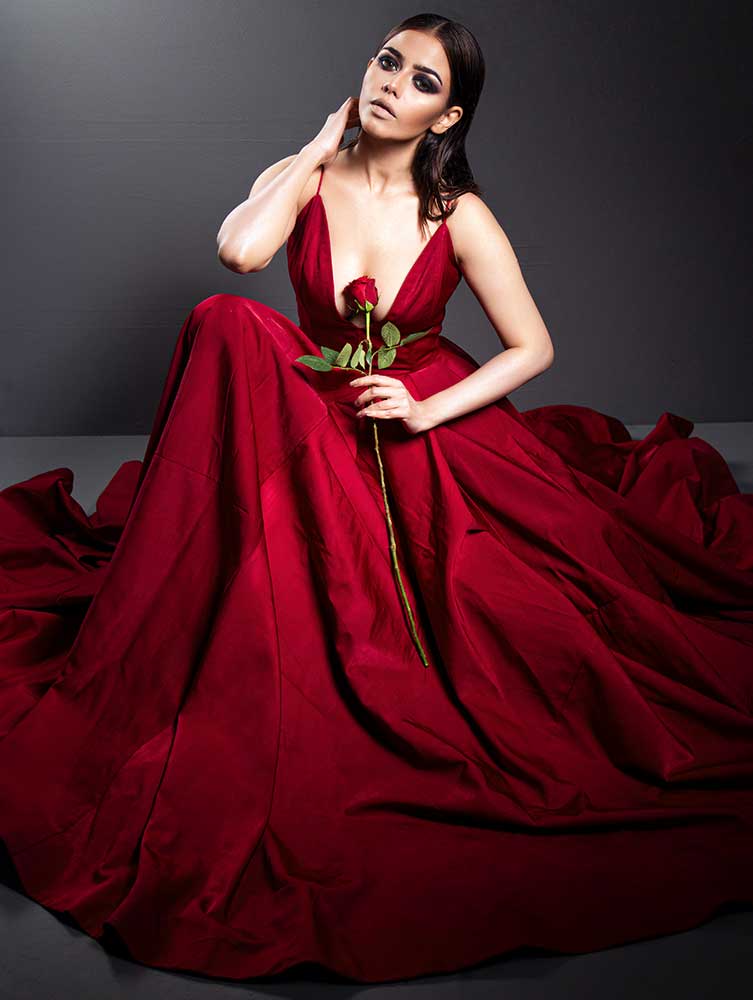 Zoe gown featuring a flattering long paneled flare